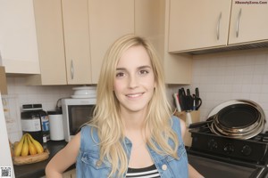 A woman in a red shirt and white shorts posing for a picture.